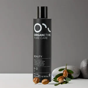 Organethic Pure Care Beauty shampoo in black bottle with argan seeds.