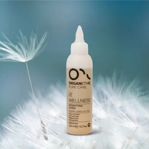 Detoxifying Lotion sitting on a dandelion