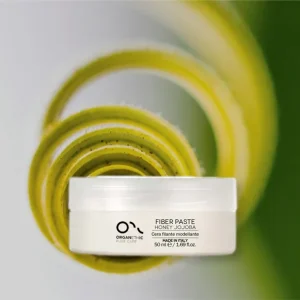 Jar of Fiber Paste for styling hair.