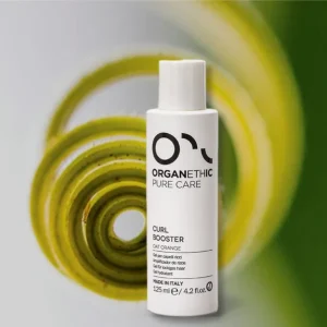 Bottle of Curl Booster for styling curly hair.