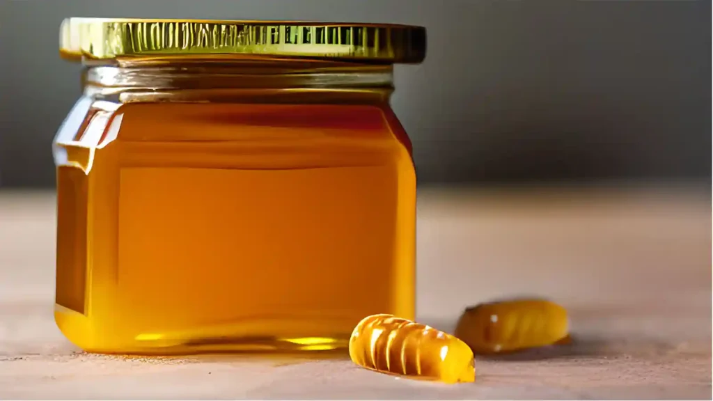 Jar of honey with honeycomb