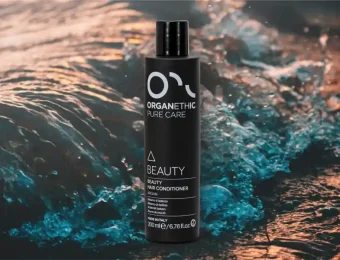 Organethic Pure Care Beauty conditioner bottle with sea in background